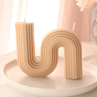 Auramma Collections Avant Basic Curvy N Shaped Stripe Finish Pastel Milk Tea Color Amber Oud Scented Candle
